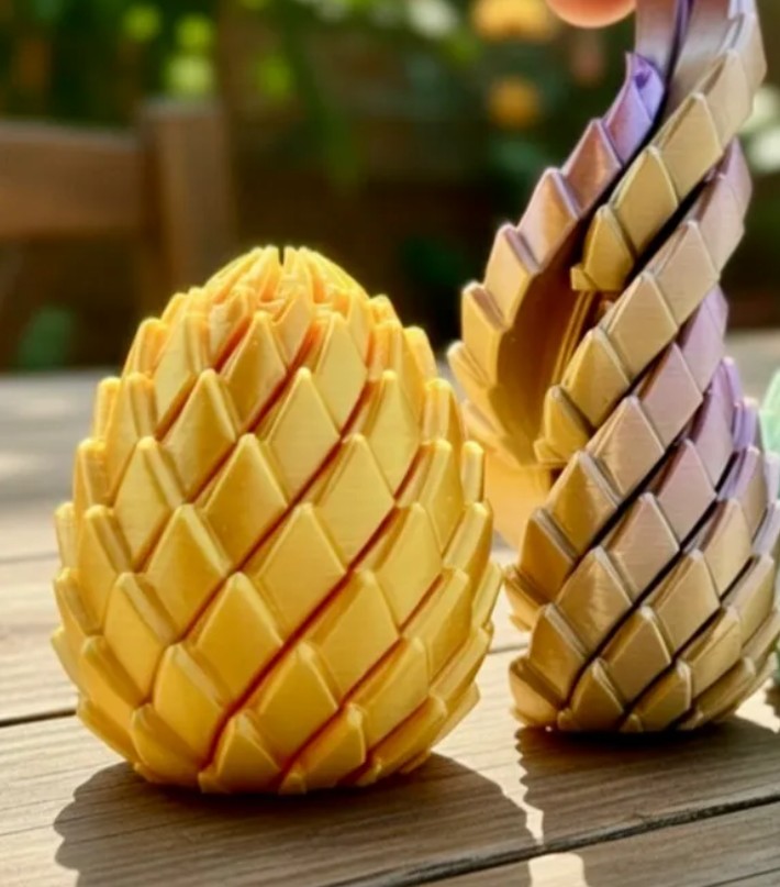 Huevos de dragón articulados en amarillo y degradado